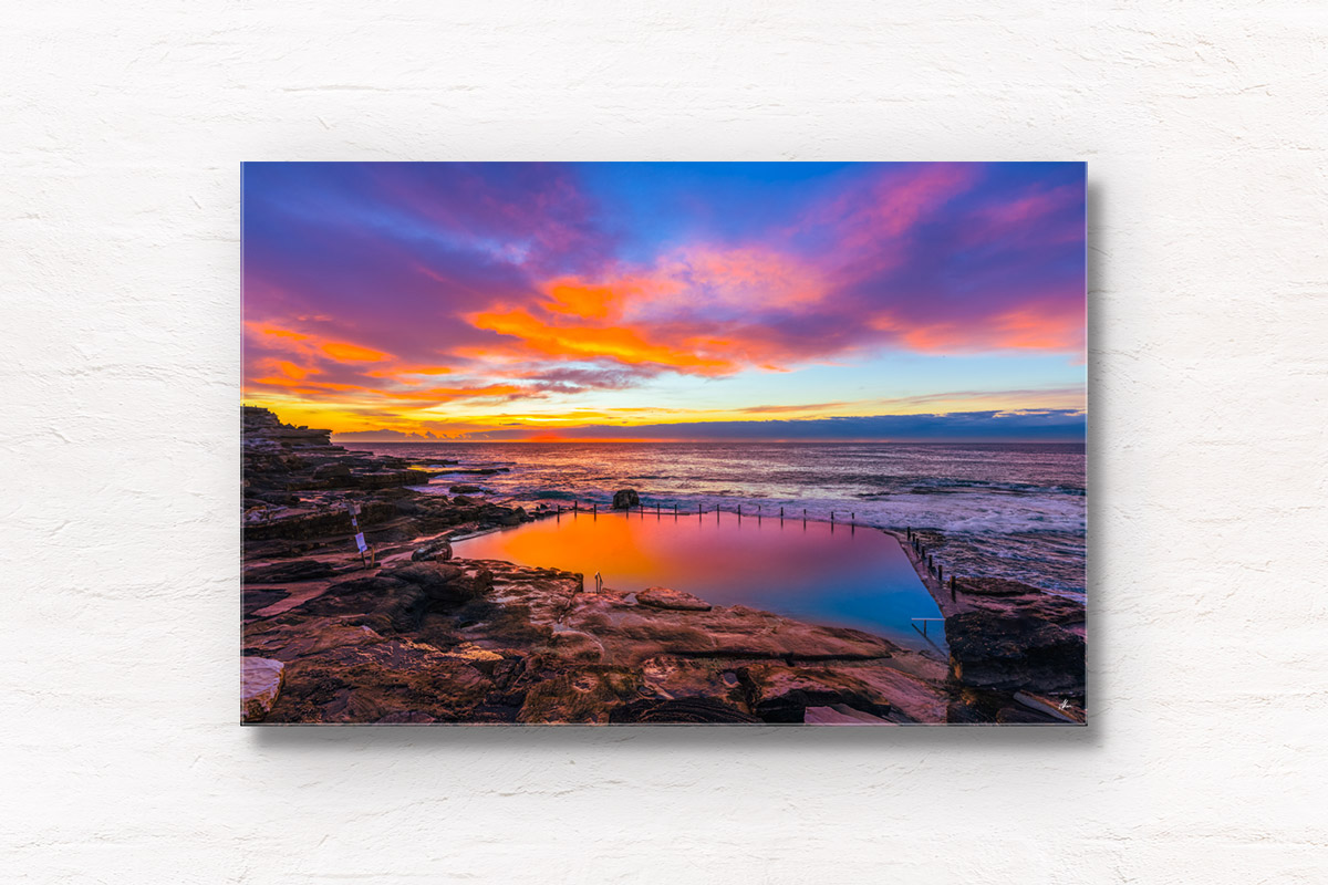 Mahon Pool Mirage. Long exposure photograph taken during a spectacular multi-coloured sunrise at Maroubra&#039;s iconic swimming pool. Framed art photography wall art print.