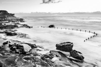 Ocean Pools Sydney. Black & White long exposure of waves crashing over Mahon Pool, Maroubra.