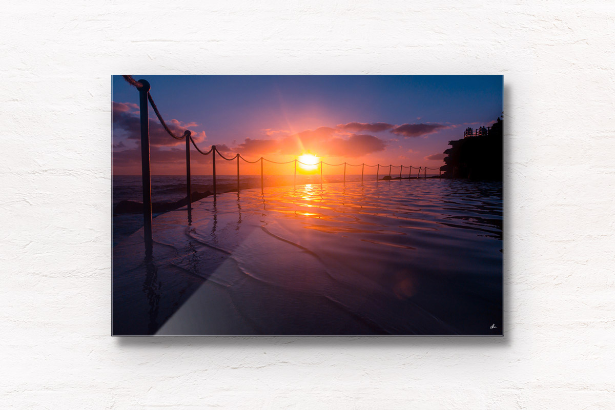 Stunning silhouetted sunrise over Bronte Rockpool