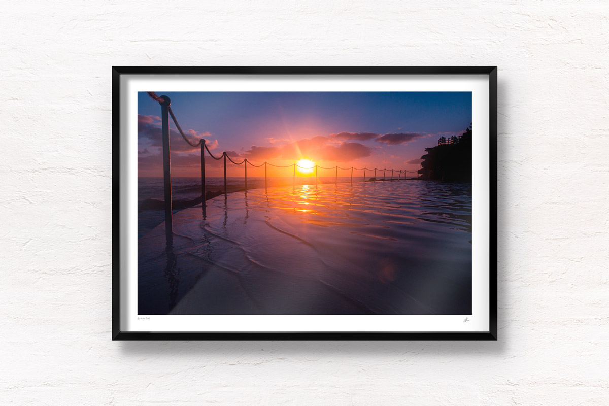 Stunning silhouetted sunrise over Bronte Rockpool