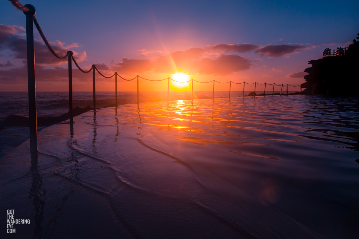 Stunning silhouetted sunrise over Bronte Rockpool