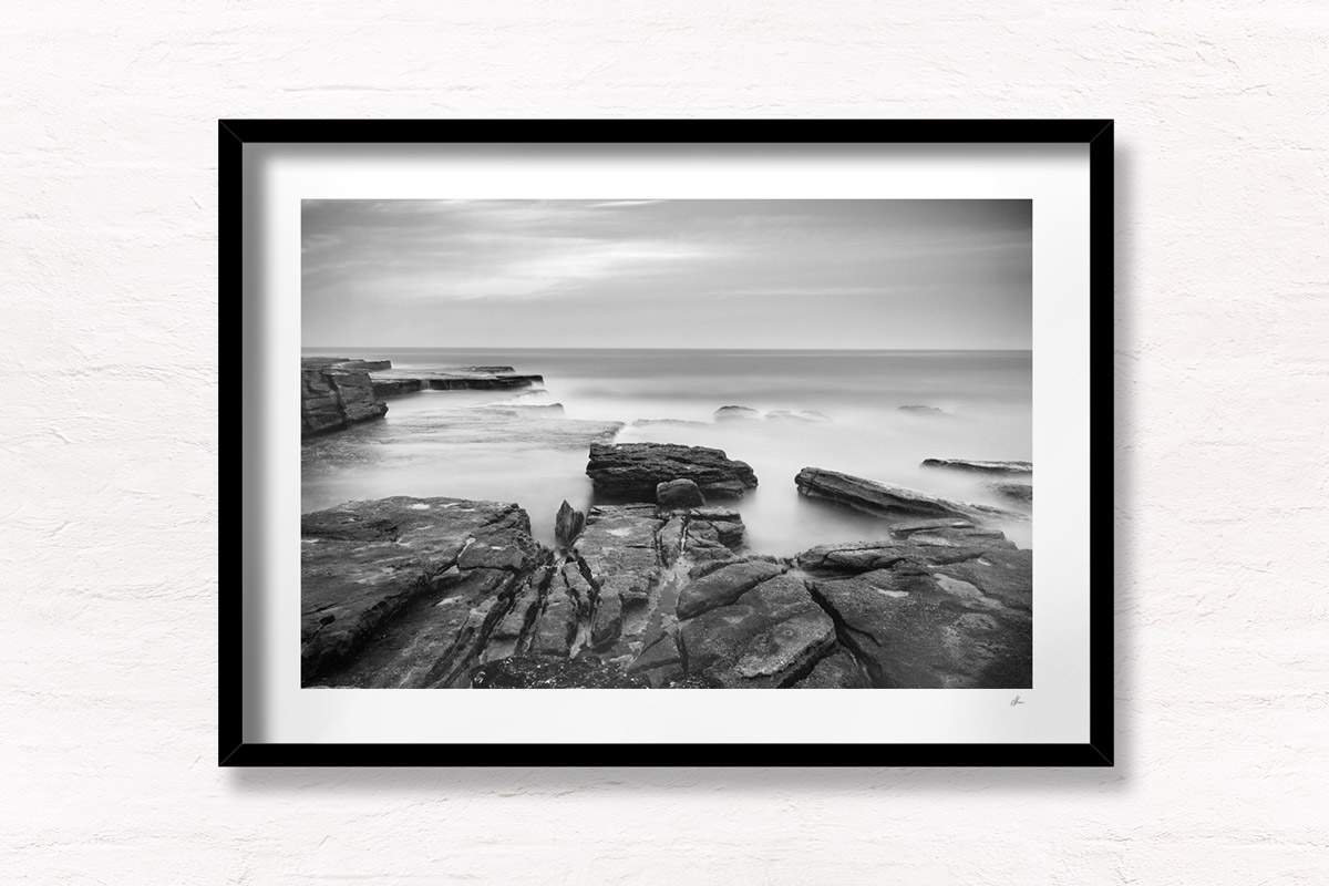Long Exposure Sydney Photography. Silky waves flowing over rock face at Mahon Pool, Maroubra.