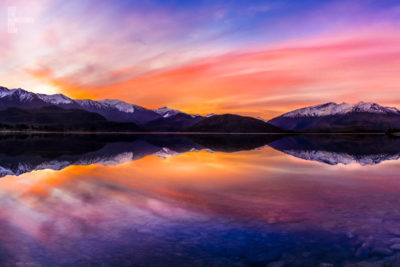 Wanaka Mountain Sunset. Beautiful sunset reflection, snow capped mountains.