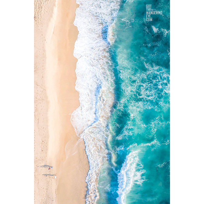 South Coast Beach aerial view of couple walking on beach