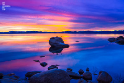 Sunset at Bonsai Rock. Purple sky reflection on Lake Tahoe