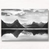 Milford Sound New Zealand. Reflection of woman and mountains at sunset.