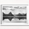 Milford Sound New Zealand. Reflection of woman and mountains at sunset.