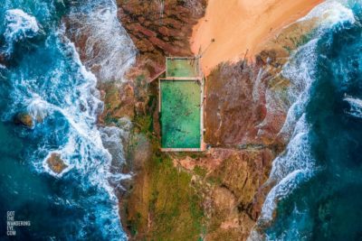 Aerial seascape above the crashing waves onto Mona Vale Rockpool