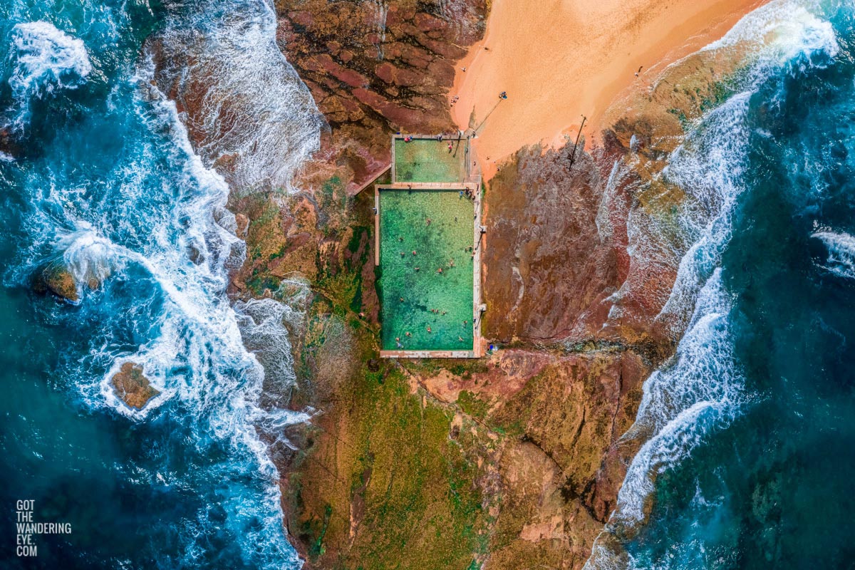 Aerial seascape above the crashing waves onto Mona Vale Rockpool