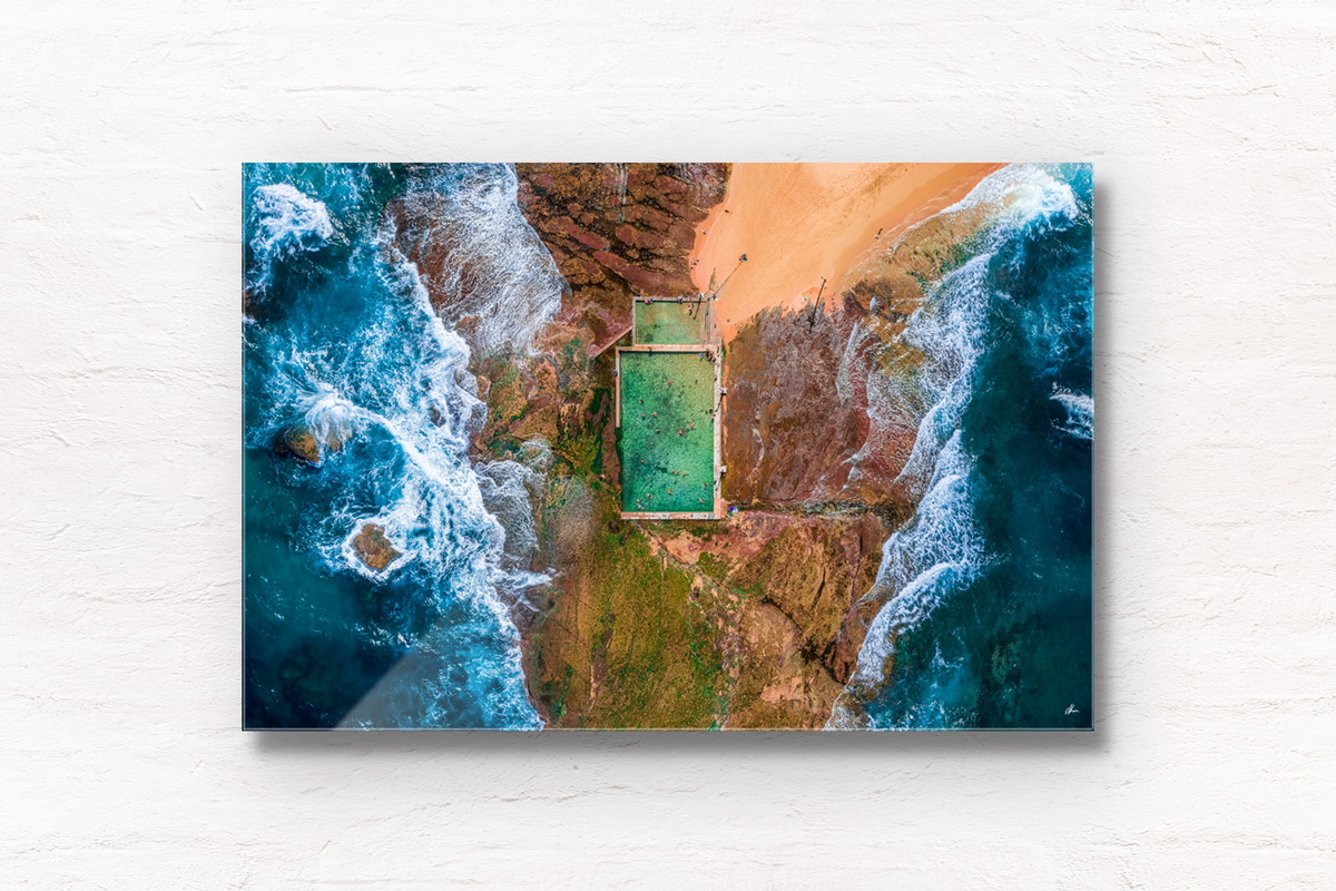 Aerial seascape above the crashing waves onto Mona Vale Rockpool