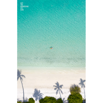 Aerial Woman on Beach, Maldives island paradise