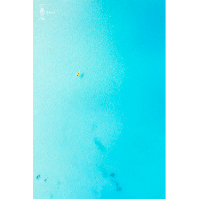 Kayaking Aerial Beach View above beautiful blue Maldives.