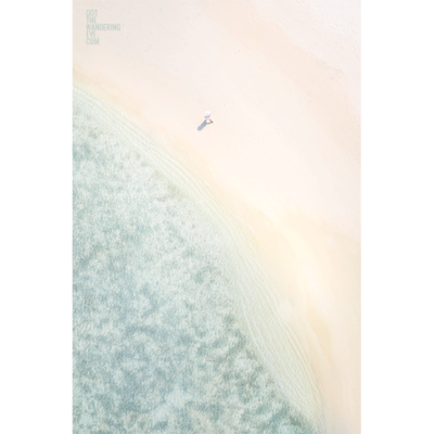 Woman Walking in Maldives. Secluded white sand beach.