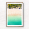 Aerial oceanscape overlooking a kayaker paddling to the beautiful South Coast's Jibbon Beach