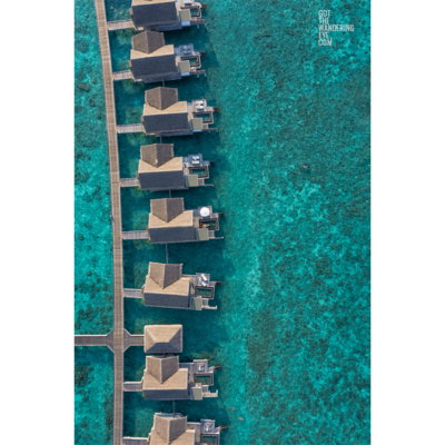 Over water villas aerial. Luxury bungalows Maldives