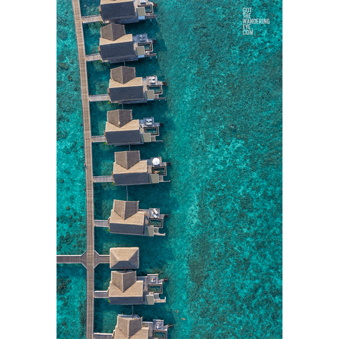 Over water villas aerial. Luxury bungalows Maldives