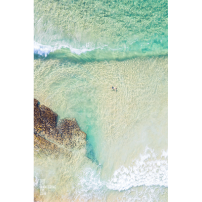 Clearwater Maroubra Beach. Man enjoying, and floating in the shallow surf at Maroubra Beach