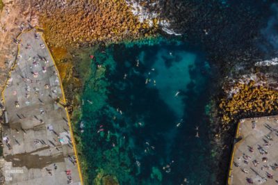 Clovelly Summer. Aerial above swimmers and snorkelers in Summer.