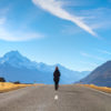 Woman Hiking towards Mount Cook National Park