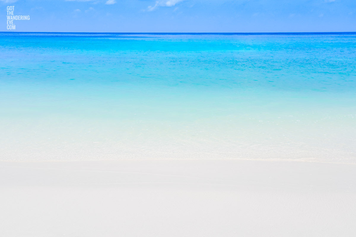 Long exposure photograph of the beautiful crystal clear blue waters at the beach at the Maldives