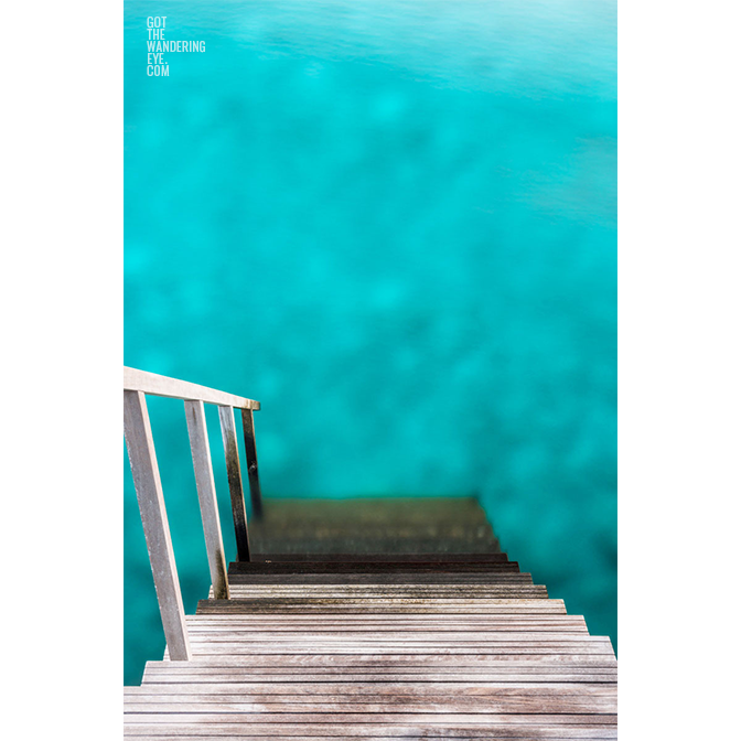 Fine Art Photography Print. Steps down from an overwater bungalow into blue lagoon, Maldives.