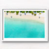 Aerial oceanscape of palm tree shadows on beautiful Maldivian Beach