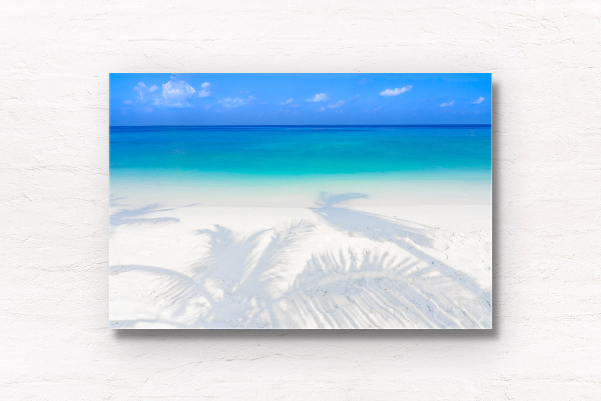 Fine Art Photography Print. Oceanscape of a tropical paradise in Maldives, with palm tree shadows and clear water.