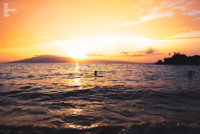 Fine Art Photography Print. Spectacular golden sunset dipping into the ocean at Black Rock, Maui, Hawaii
