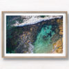 Aerial photograph of a man swimming in The Bogey Hole, Bronte Beach