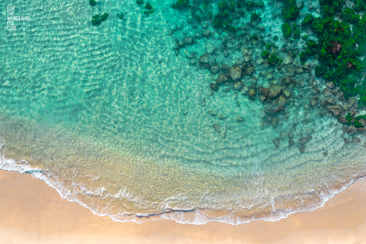 Aerial oceanscape above the Bogey Hole and turquoise waters of Bronte Beach