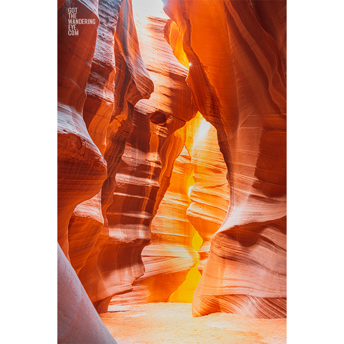 Looking through the swirling sandstone textures of the slot canyon at upper Antelope Canyon, Arizona.