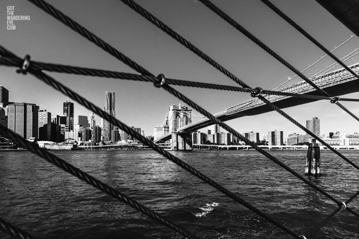 Artistic abstract image looking through cables in D.U.M.B.O at the Brooklyn Bridge, New York