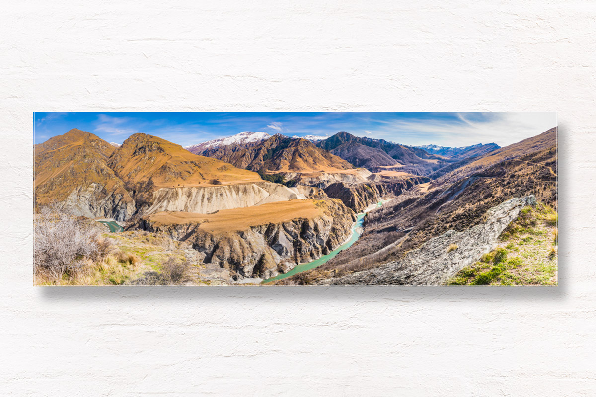 Panoramic of Skippers Canyon, one of New Zealand's richest gold-bearing rivers, with snow capped mountains