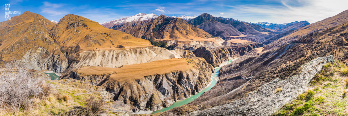 Panoramic of Skippers Canyon, one of New Zealand's richest gold-bearing rivers, with snow capped mountains