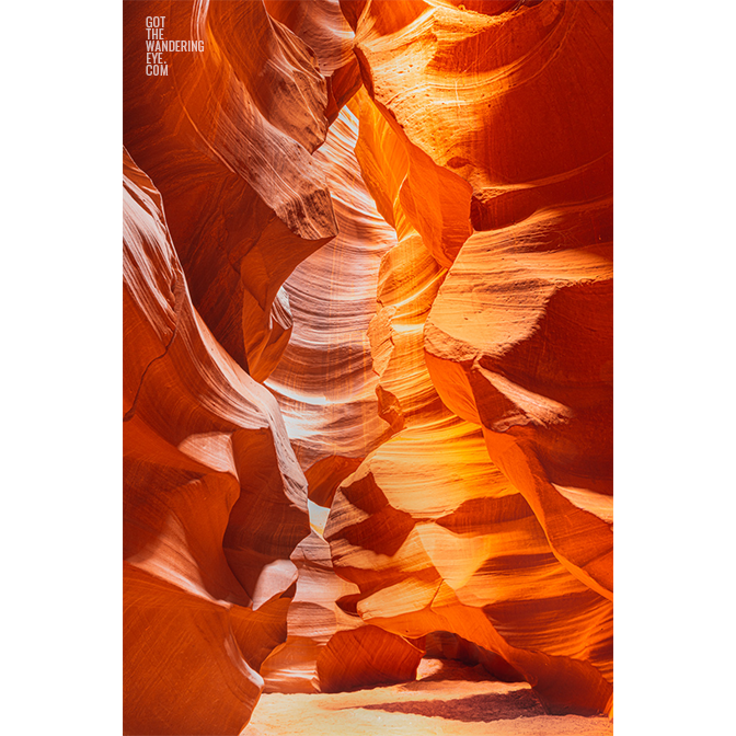 Looking through the swirling sandstone textures of the slot canyon at upper Antelope Canyon, Arizona.