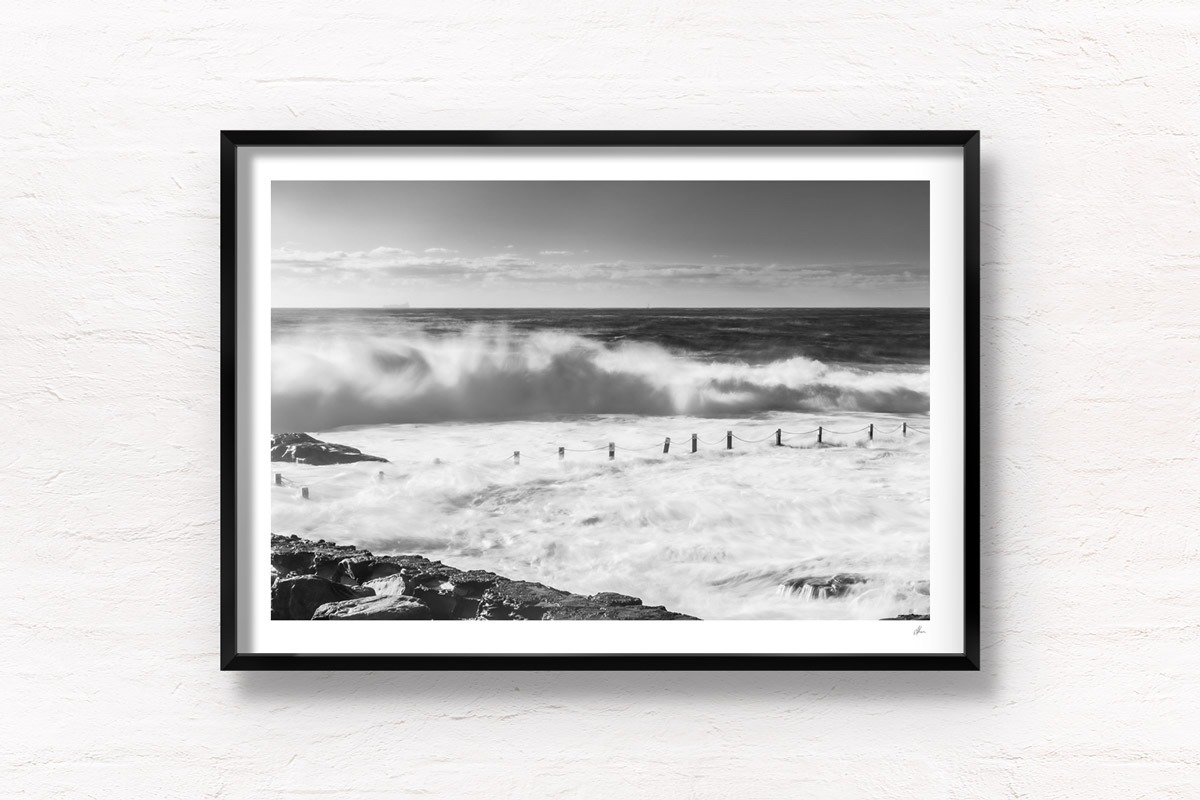 Black & White image of huge waves crashing over Mahon Pool, Maroubra