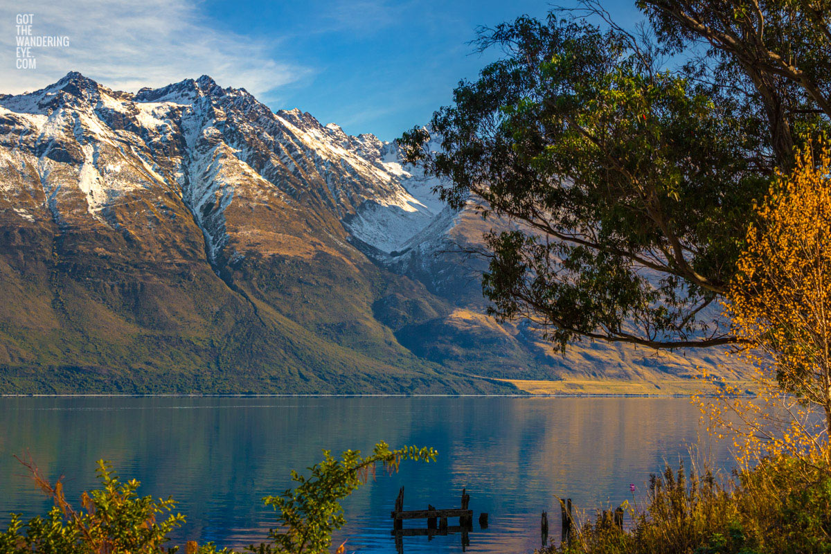 The old wharf at Lake Wakitipu with snowcapped mountains in the background during Autumn