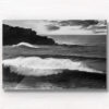 Black and white photo of huge waves crashing over Bondi Beach