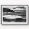 Black and white photo of huge waves crashing over Bondi Beach