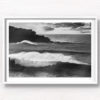 Black and white photo of huge waves crashing over Bondi Beach