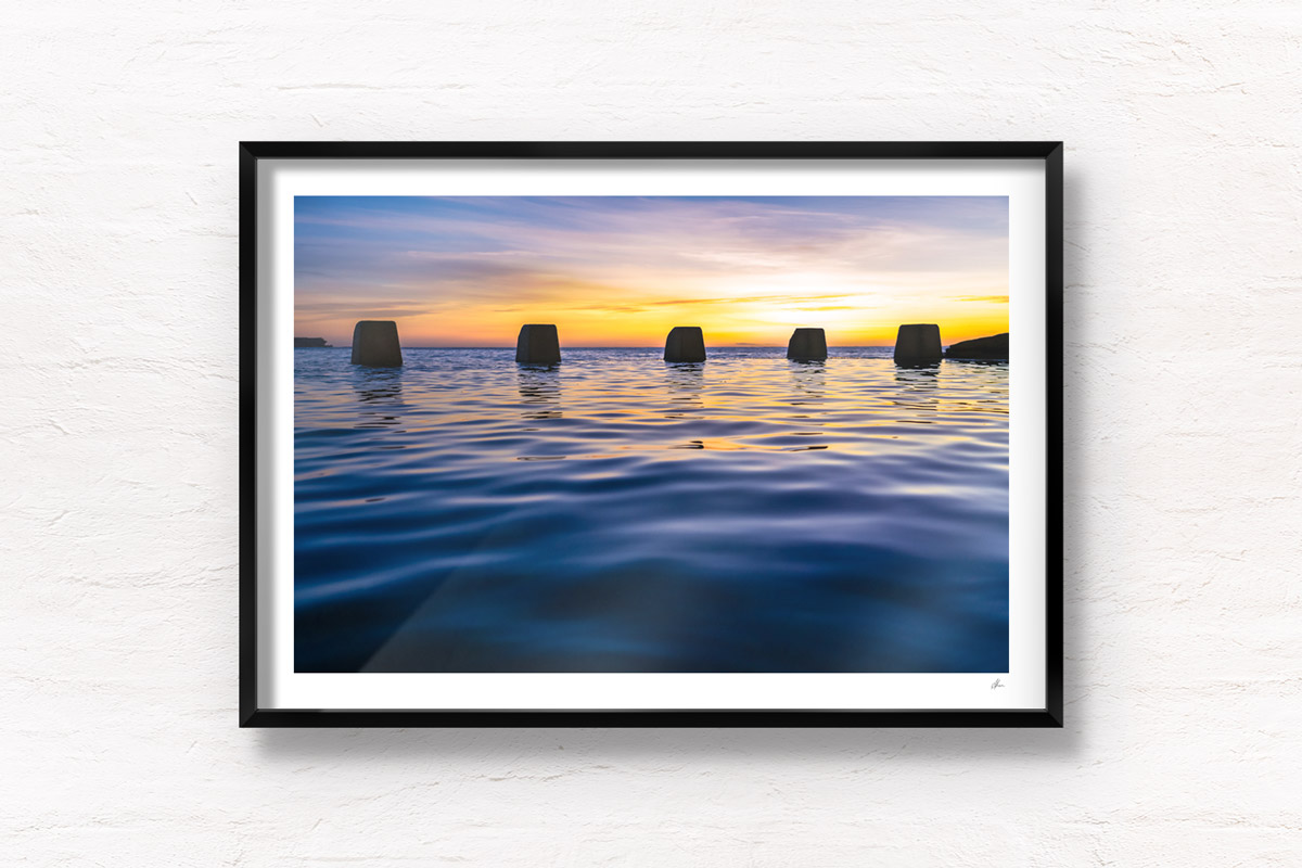 Close up of calm water and ocean ripples of The Ross Jones Memorial Pool at Coogee during a beautiful sunrise