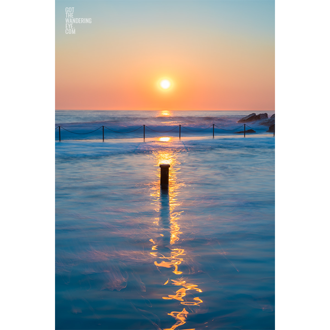 Long exposure photo of Wylies Baths ocean rockpool during sunrise at Coogee