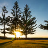 A couple enjoying a beautiful sunrise and morning walk along Coogee Beach