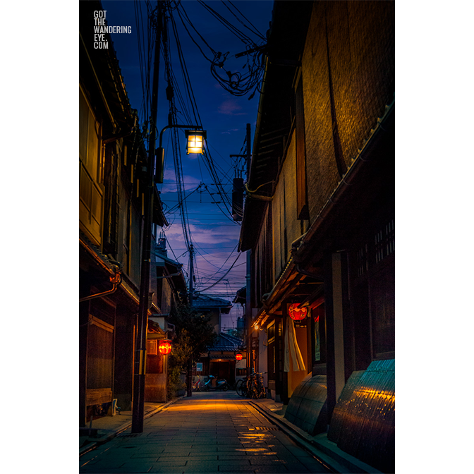 Night time street scape of the most famous geisha district. With lit lanterns in a quiet alleyway in Gion, Kyoto, Japan