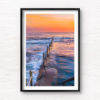 Long exposure photo of Wylies Baths ocean rockpool during sunrise at Coogee