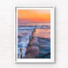 Long exposure photo of Wylies Baths ocean rockpool during sunrise at Coogee