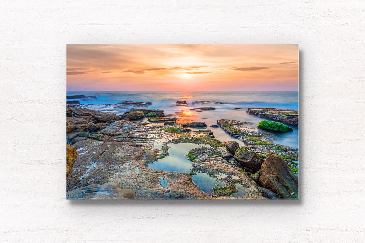 Sunrise over the ocean and puddles at Mahon Pool, Maroubra