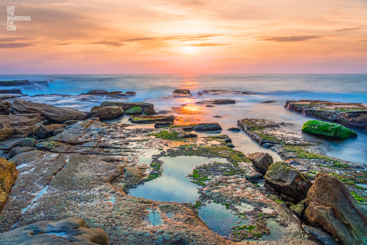 Sunrise over the ocean and puddles at Mahon Pool, Maroubra