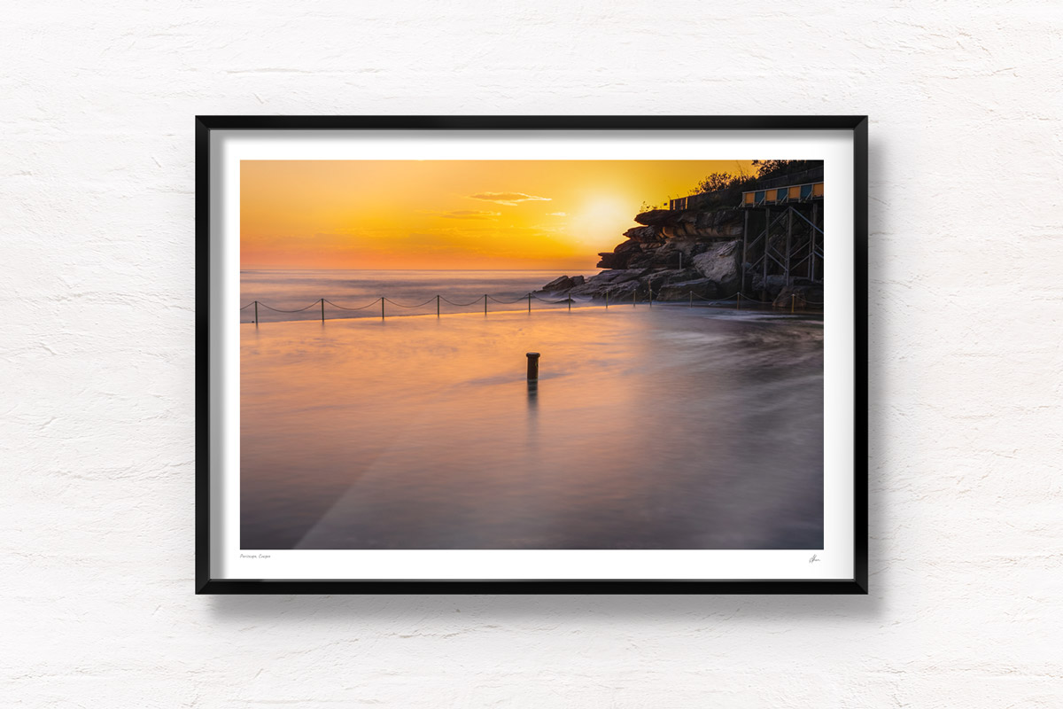 Long exposure of the sun rising over the iconic ocean pool, Wylies Baths in Coogee