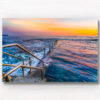 Long exposure photo of Wylies Baths ocean rockpool during sunrise at Coogee